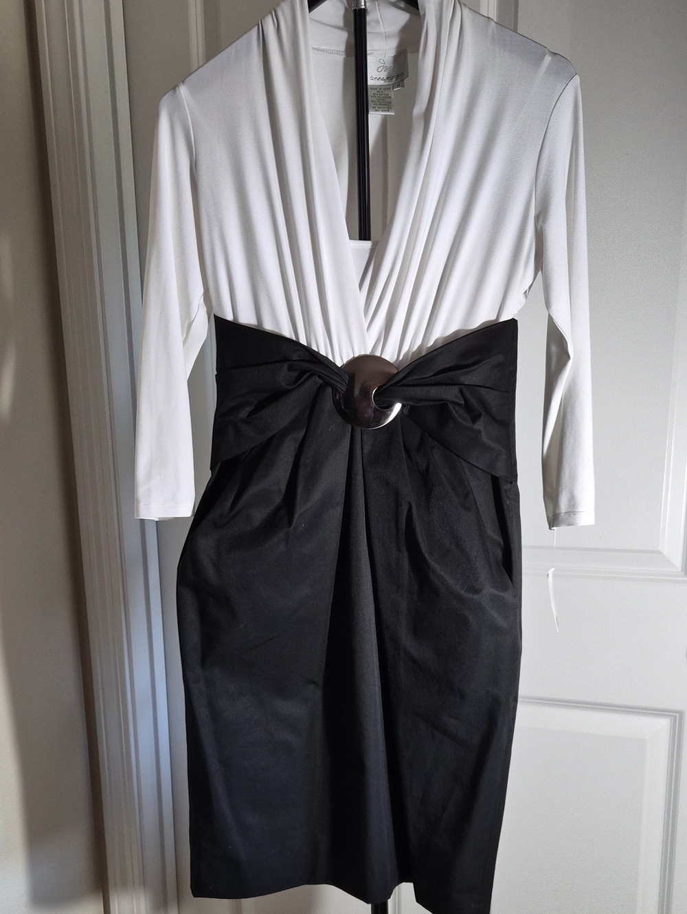 Donna Morgan White V-Neck Long Sleeve Dress with Black Skirt and Statement Ring